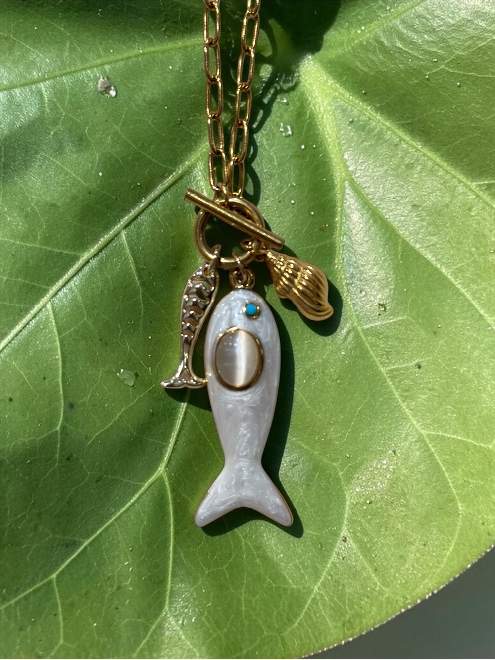 Gold Chain Necklace with White Enamel Fish Pendant and Shell Accent